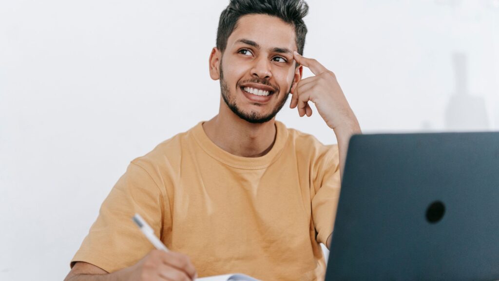 man thinking while on computer